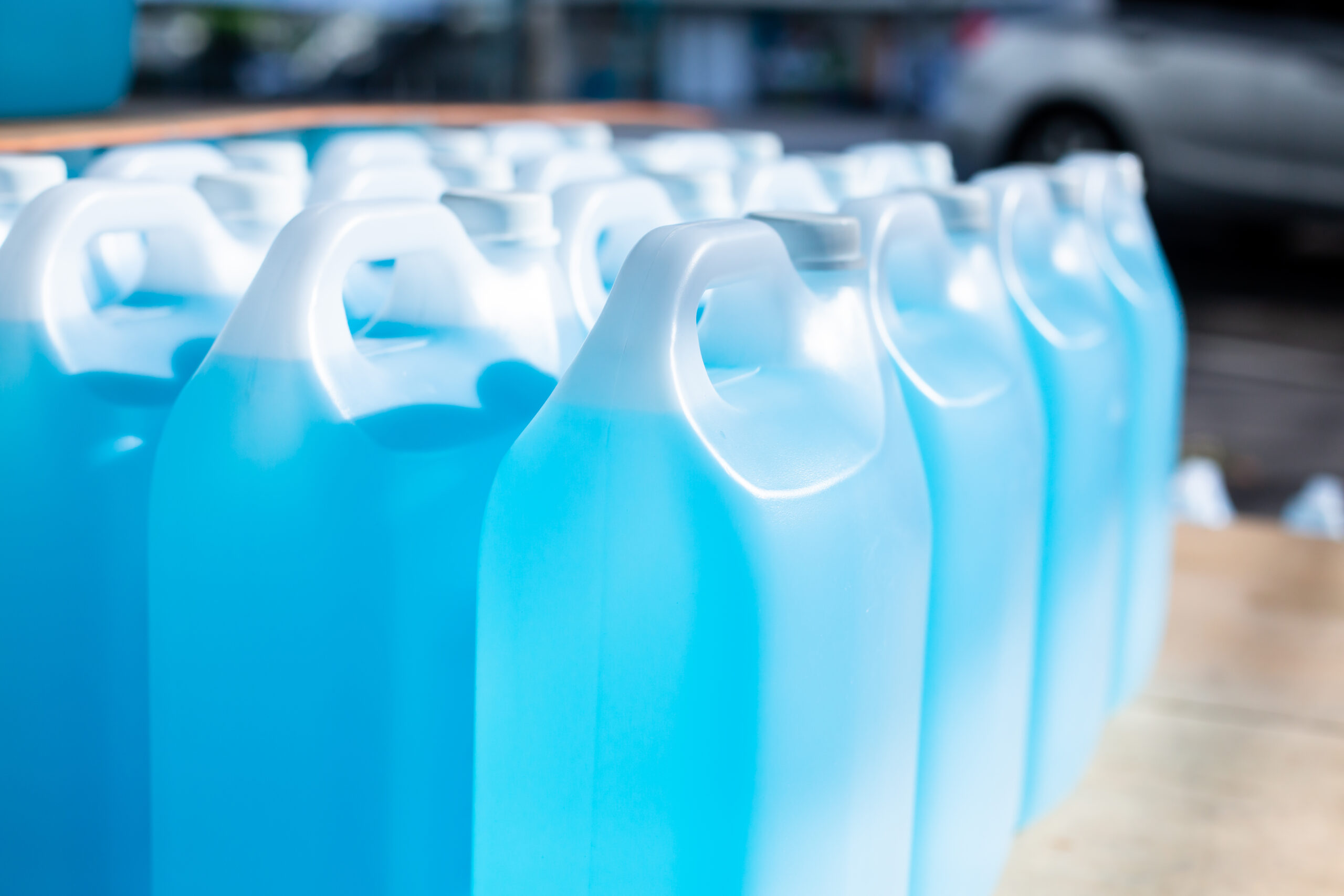 Alcohol for cleaning and sanitizing is contained in gallons in the warehouse. Many gallon alcohol gel for sanitizing Coronavirus Covid-19. Products for sale to anti Coronavirus protection (Covid 19).