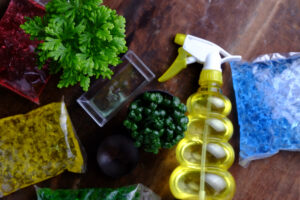 directly-shot-crystal-soil-packages-with-potted-plant-cleaning-product-table