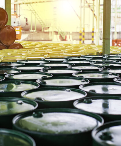 Oil barrels green or chemical drums vertical stacked up Oil barrels green or chemical drums vertical stacked up the industry